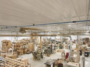 Inside of a large wood working shop.